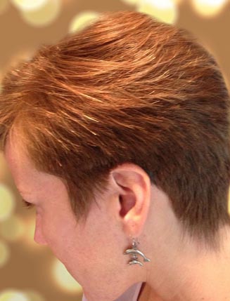 Side profile of a brunette with Roots Organic Salon haircut