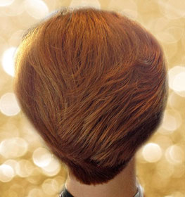 roots organic medium short haircut back view of woman with red hair