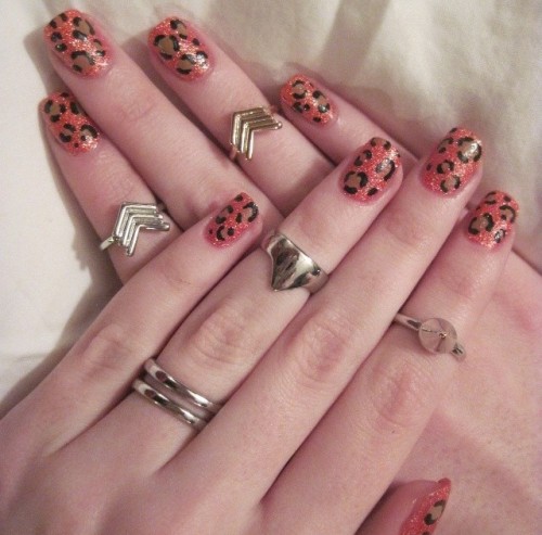 photo of hands showing decorative tiger spot nail polish 