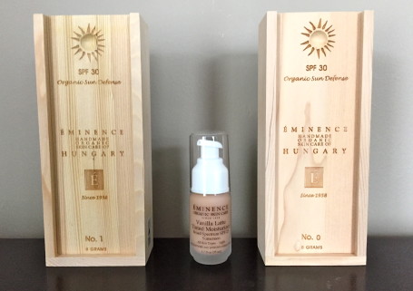 view of eminence skin product on a shelf with wood product boxes